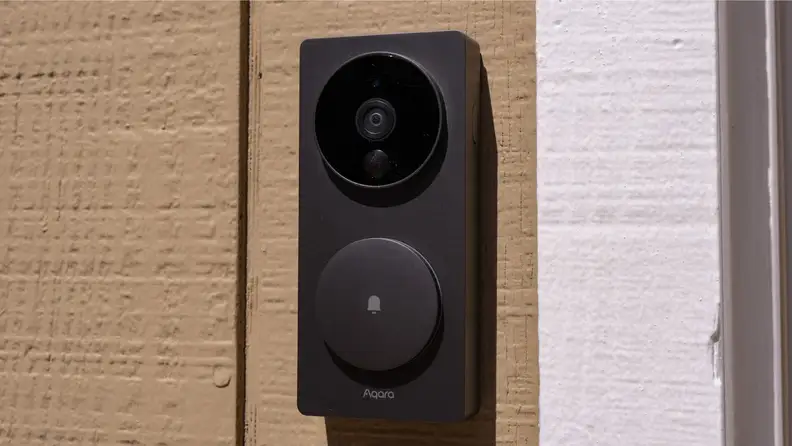 The Aqara Video Doorbell on the side of a home