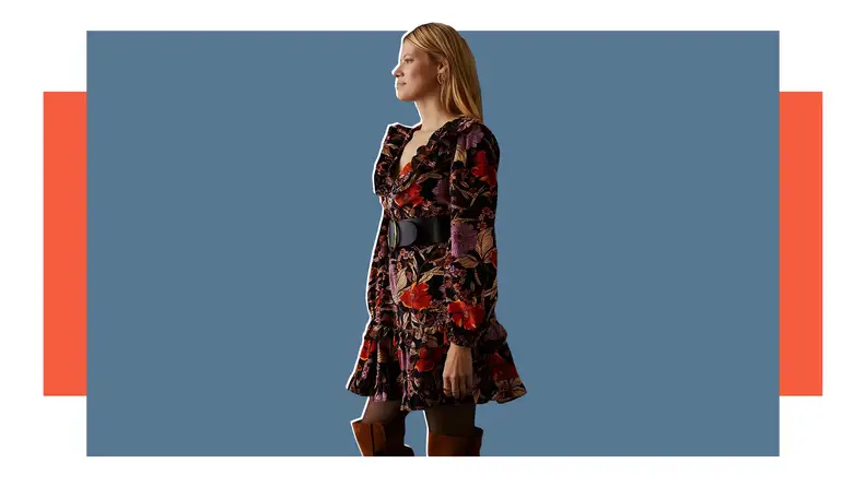 A woman in a Pilcro corduroy dress with a botanical print.