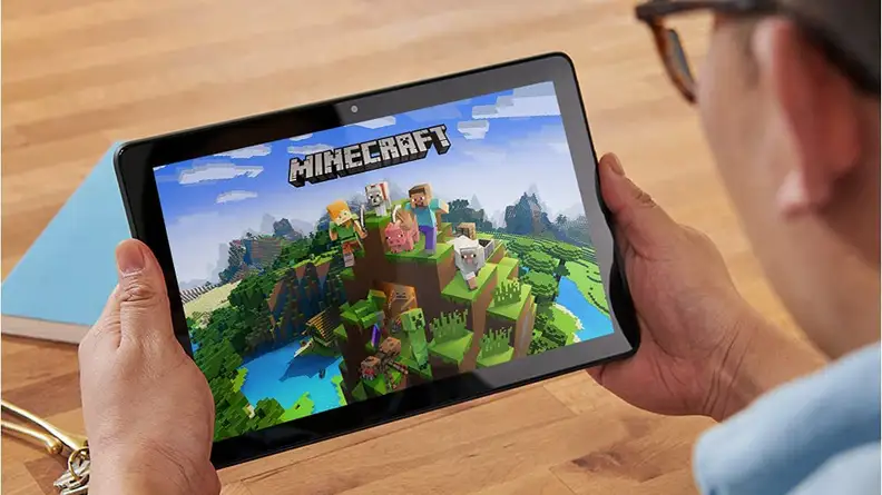 Person using tablet to play virtual game.