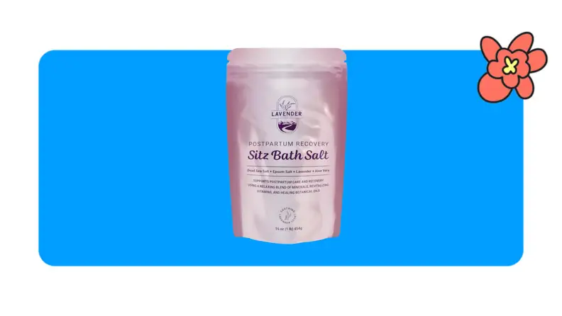 A single pink metallic bag filled with Lavender Sitz Bath salts in front of a blue background with a red cartoon flower in the corner.