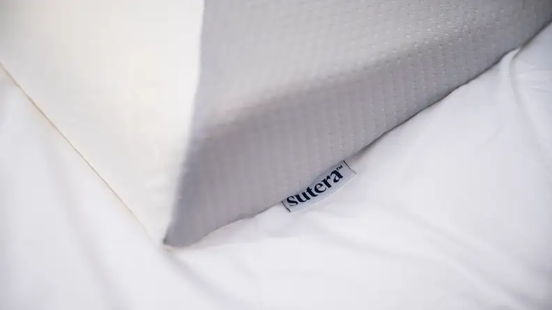 close shot of the Dream Deep pillow with its Sutera tag