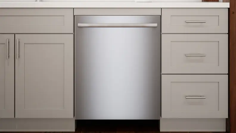 The Bosch 800 Series SGX78B55UC dishwasher installed into a set of modern kitchen cabinets.
