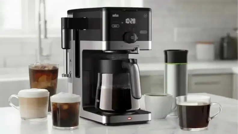 Braun coffee maker with a carafe surrounded by iced and hot coffee drinks