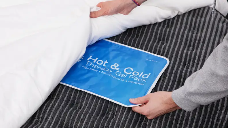 A gel pack underneath the mattress sheets.