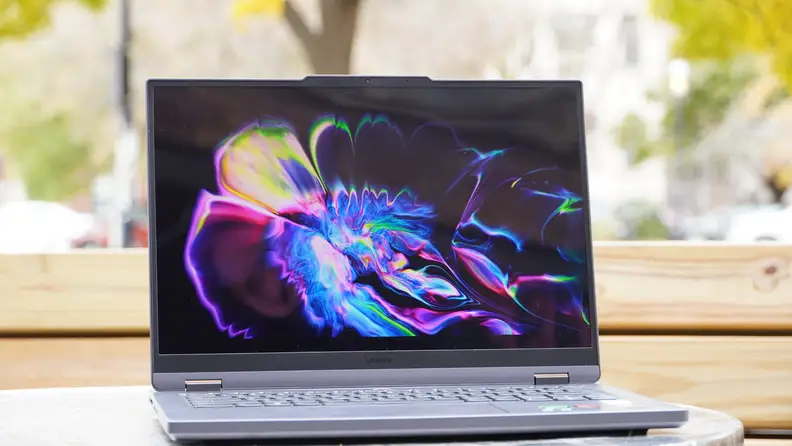 The Lenovo Legion Slim 5 14APH8 laptop open, on a desk.
