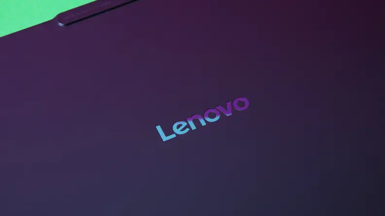 A close-up of the Lenovo logo on a Lenovo Yoga Slim 7x (2024) laptop.