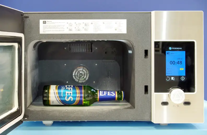 Frigondas Microwave Freezer with a cold beer inside
