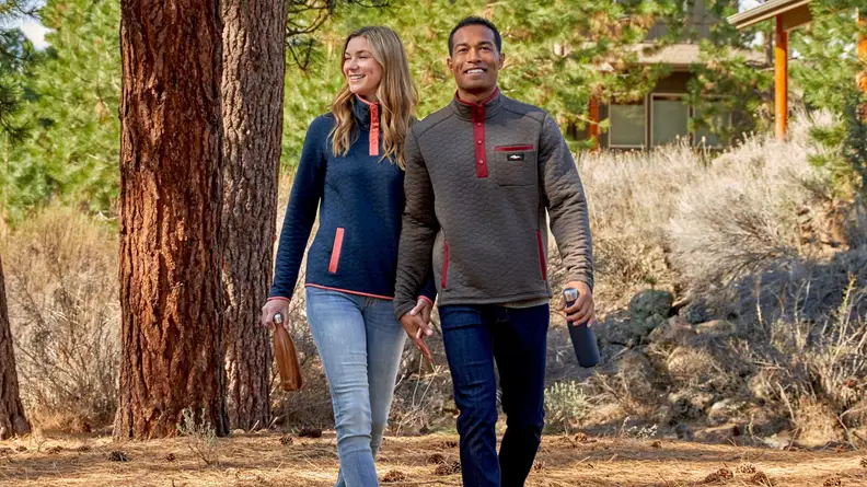 Couple walking in woods