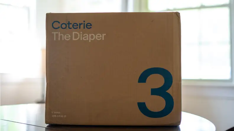 Brown cardboard box branded with Coterie The Diaper.