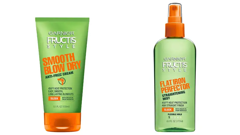 The products the author uses on her hair before blowdrying it.