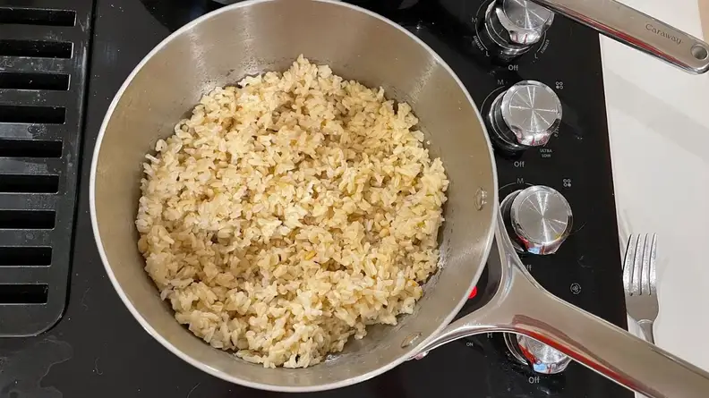 Cooked rice inside of pot.