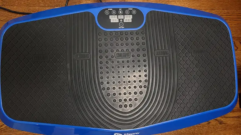 A top view of the Lifepro Hovert 3D Vibration Plate on top of a hardwood floor surface.
