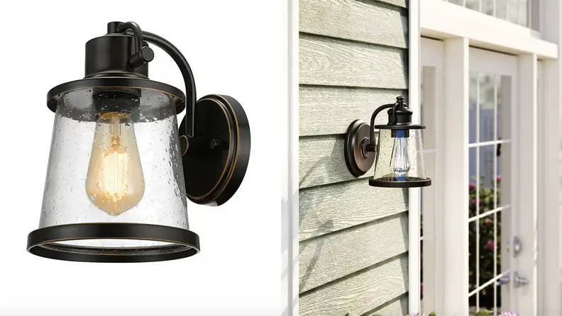 A sconce against a white backdrop, and then installed before a door, among the best modern outdoor lighting ideas.