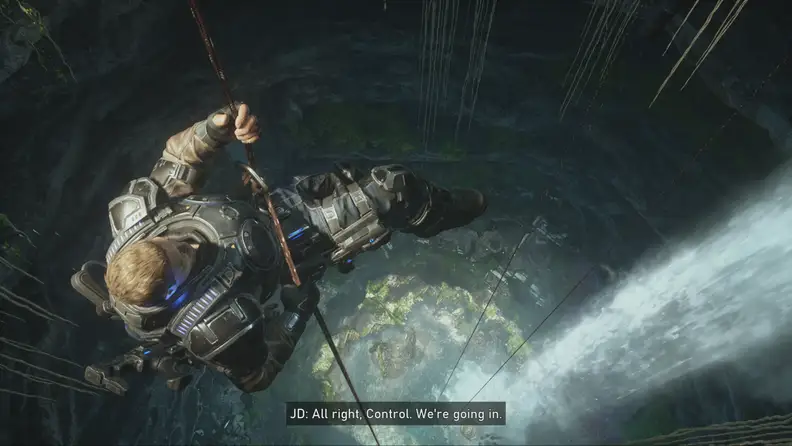 Screenshot of the video game 'Gears 5' showing off one of the main characters roping down into a chasm.