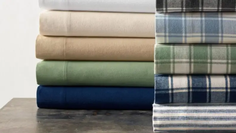 flannel LL Bean sheets stacked on a table in various colors and plaid