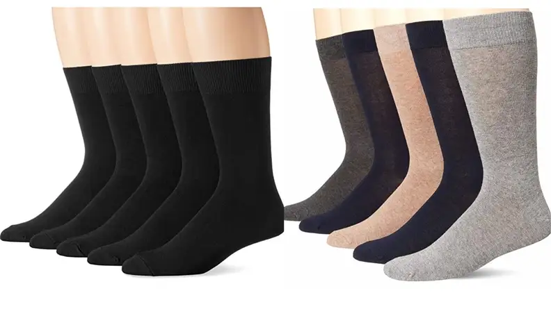 Row of black Amazon Essential socks worn on the feet, row of colored Amazon Essentials socks.