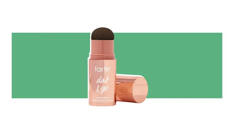Tarte beauty product on a green background.