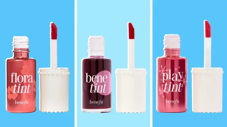 Three tubes of lip and cheek tint makeup next to applicator wands.