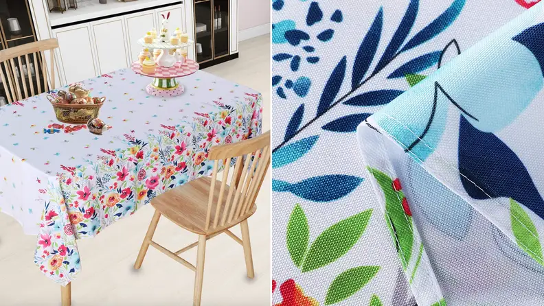 Product shot of white and multi-colored floral tablecloth.