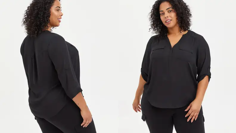 Woman wearing a black button down shirt