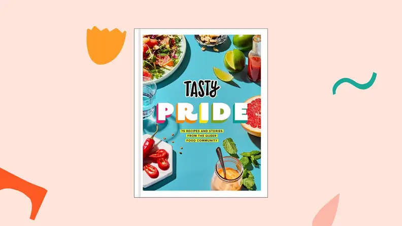 The Tasty Pride cookbook against a light pink background.
