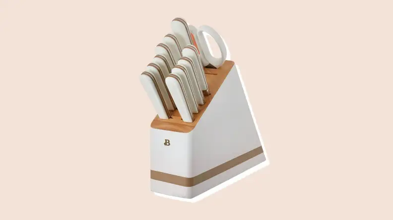 Product shot of knife block with white knives inside from the Beautiful by Drew Barrymore Kitchen Appliances line.