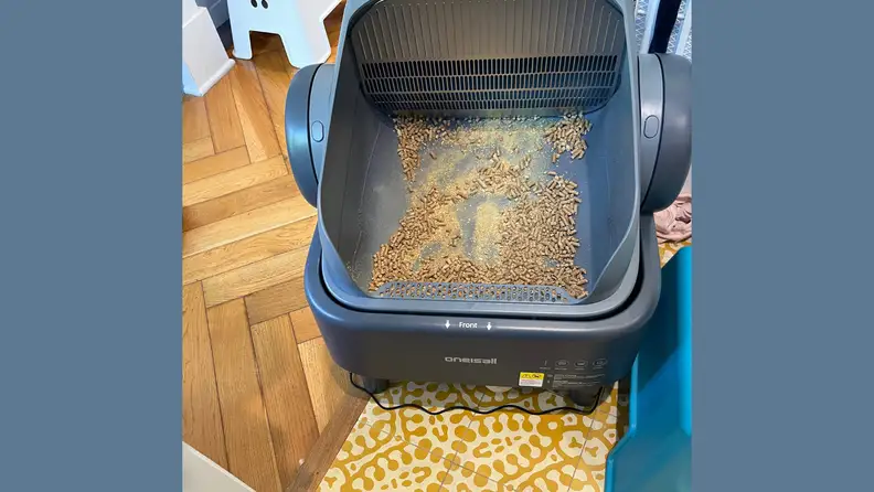 Cat litter pellets in a litter box in a home environment