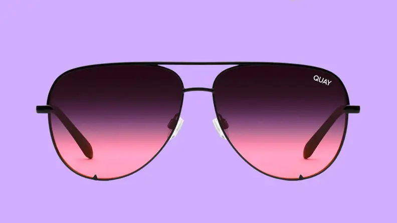An image of a pair of pink-lensed aviator sunglasses with black, thin frames.