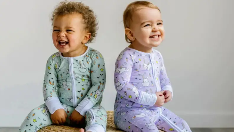 Two children in Easter jammies. One is in mint and one is lavender.