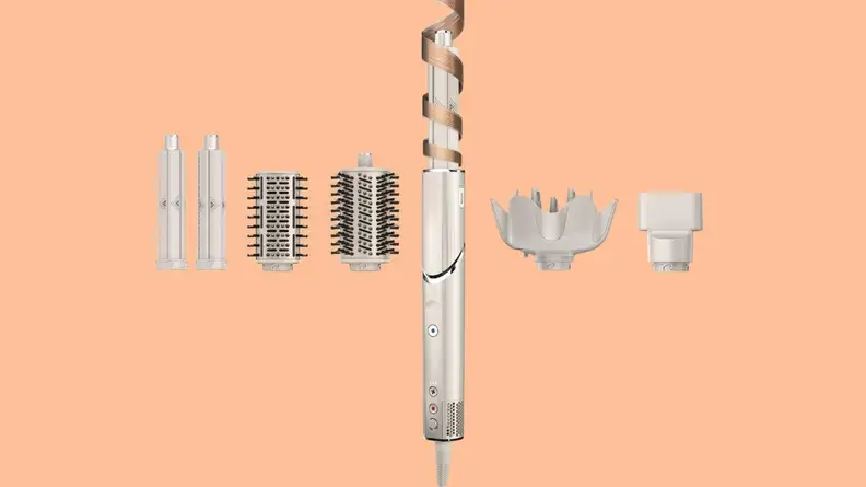 The Shark Flexstyle tool with its various attachments against a coral background.