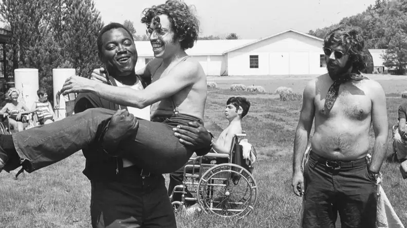 A black-and-white photo from Crip Camp featuring campers and staff.