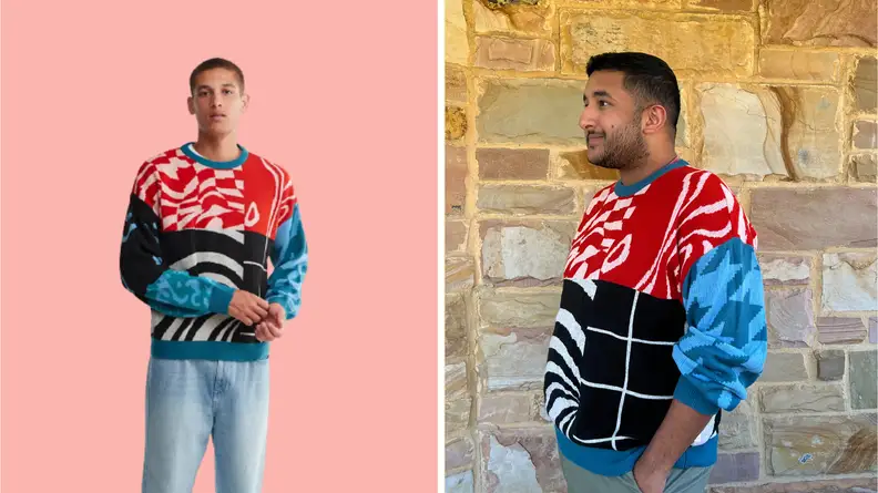 A model showing off a men's crewneck sweater