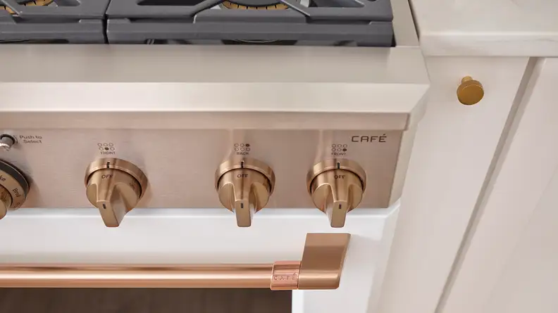 Warm metals are gaining in popularity, and they look amazing on this GE Cafe range.