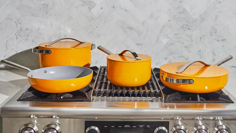 A set of yellow ceramic cookware.