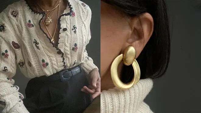A person wearing a white knitted sweater with flower details and a person wearing gold hoop earrings.