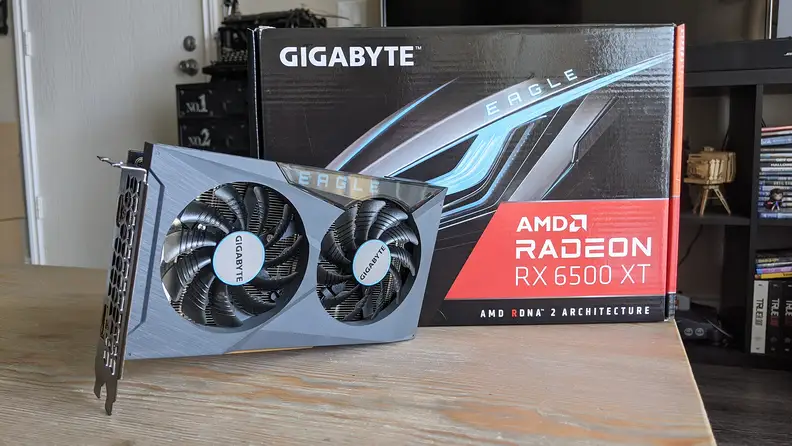 A desktop graphics card standing up next to its box