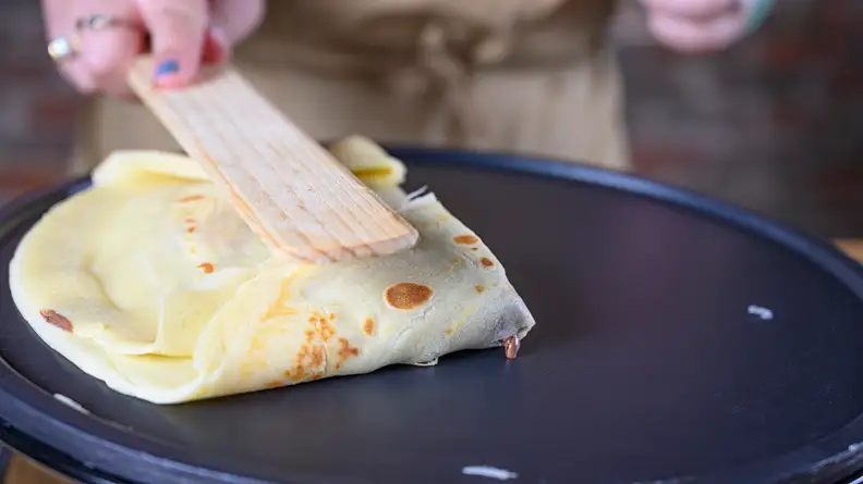 Fold the crepes once they're filled and done cooking.