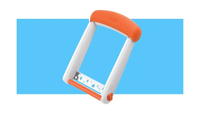 An orange and white cheese slicer against a blue background.