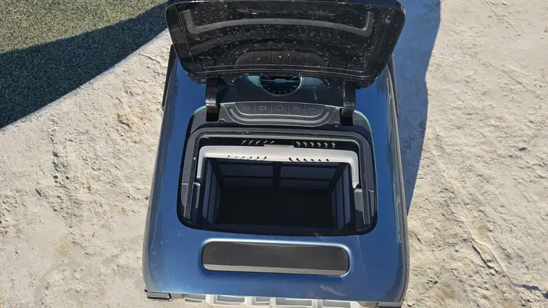 Beatbot AquaSense Pro  robot pool vacuum sitting near the pool.