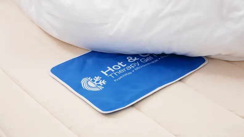 A blue heated pad placed strategically under the Birch Natural Mattress.