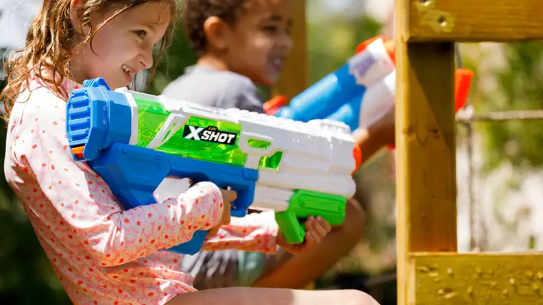 A girl uses the Zuru X-Shot Fast Fill water gun