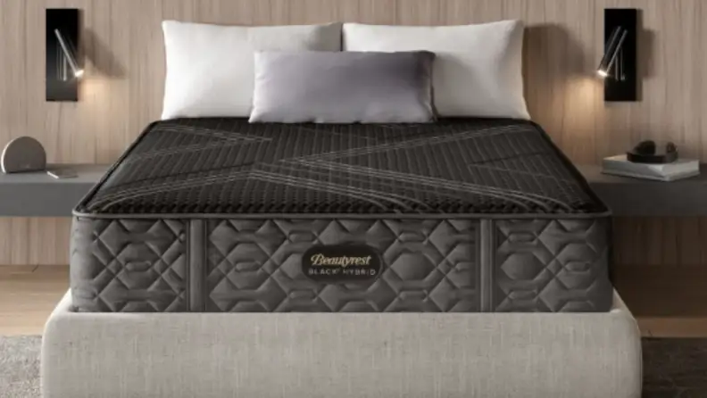 Beautyrest Black® Hybrid Collection mattress with three white pillows on top.