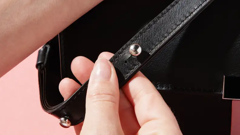 Close-up photograph of the leather strap on the Behno Simone Double Base Crossbody bag.