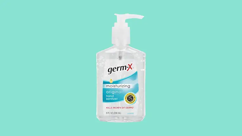 Bottle of hand sanitizer against teal background
