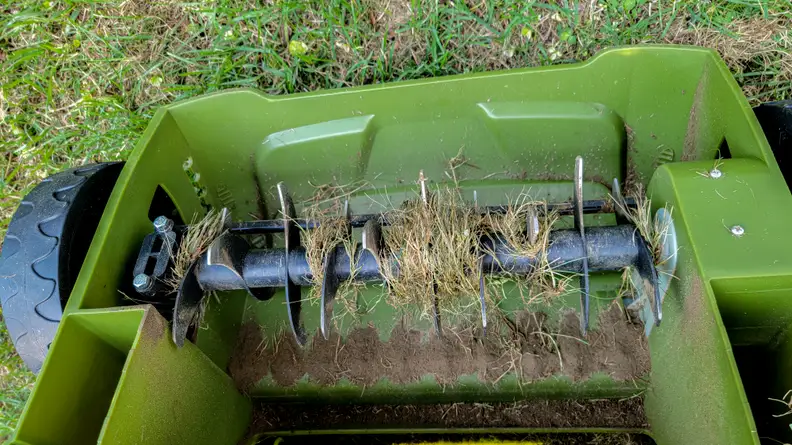 Scarifying spikes of an overturned dethatcher