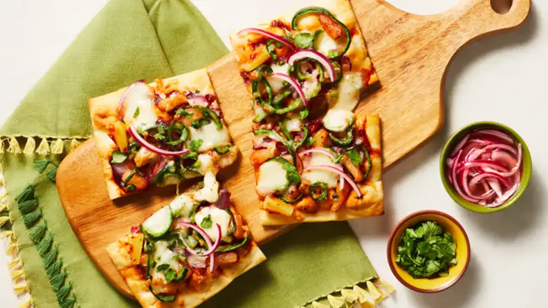 HelloFresh's BBQ Chicken Pineapple Flatbread displayed on a surface.
