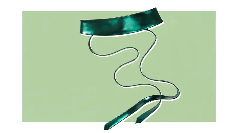 Product shot of a satin Obi belt with long tie strings.