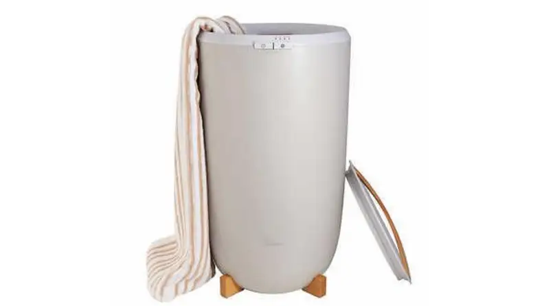 A towel warmer with a towel hanging off of it