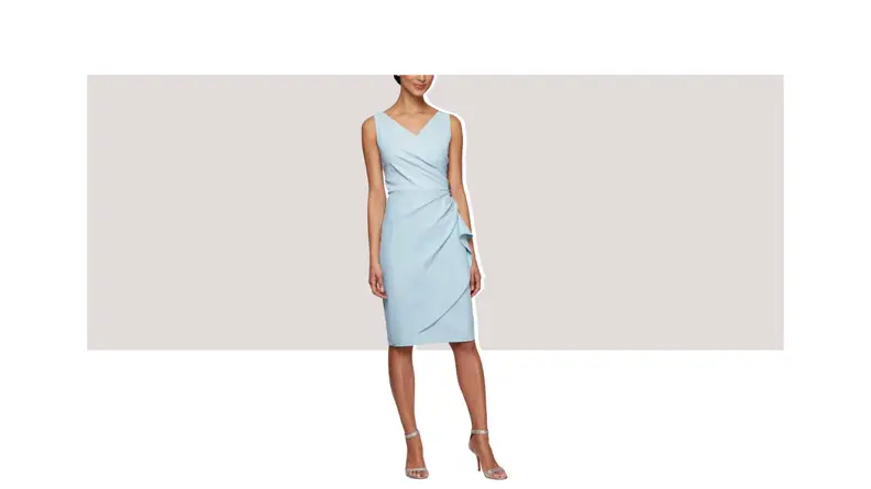 A model wearing a light blue knee-length dress with ruching detail on the side.