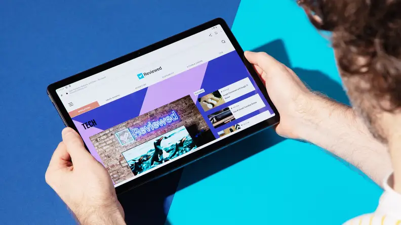 A man holds the Lenovo Tab P11 Pro 2